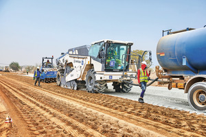  1 The Wirtgen soil stabilisers homogeneously mix the previously distributed cement into the road bed at the required depth. Regulated by the speed of the machine, a spray bar automatically adds the required amount of water to the cement 