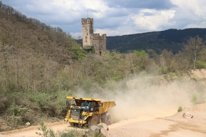  2	One of five dump trucks on its way towards the twelfth level 