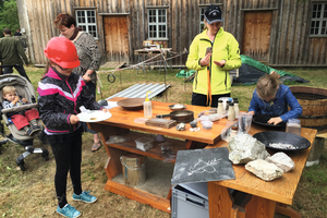  2 Children washing and jigging rocks 